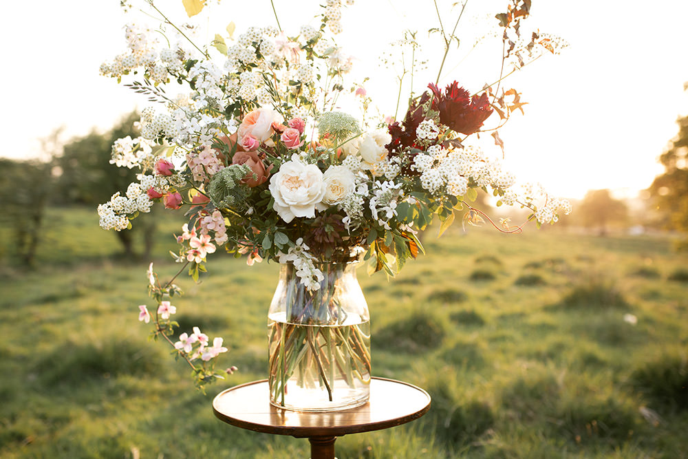 Table Flowers Peach Coral Cream Roses Greenery Foliage Large Vase Tall Light Airy Summer Wedding Ideas Charlotte Palazzo Photography