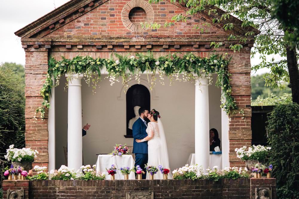 Bride Bridal Dress Gown Lace Sleeves Bodice Train Flower Crown Blue Suit Groom Bouquet Jewel Tone Pink Blue Micklefield Hall Wedding Red On Blonde Photography