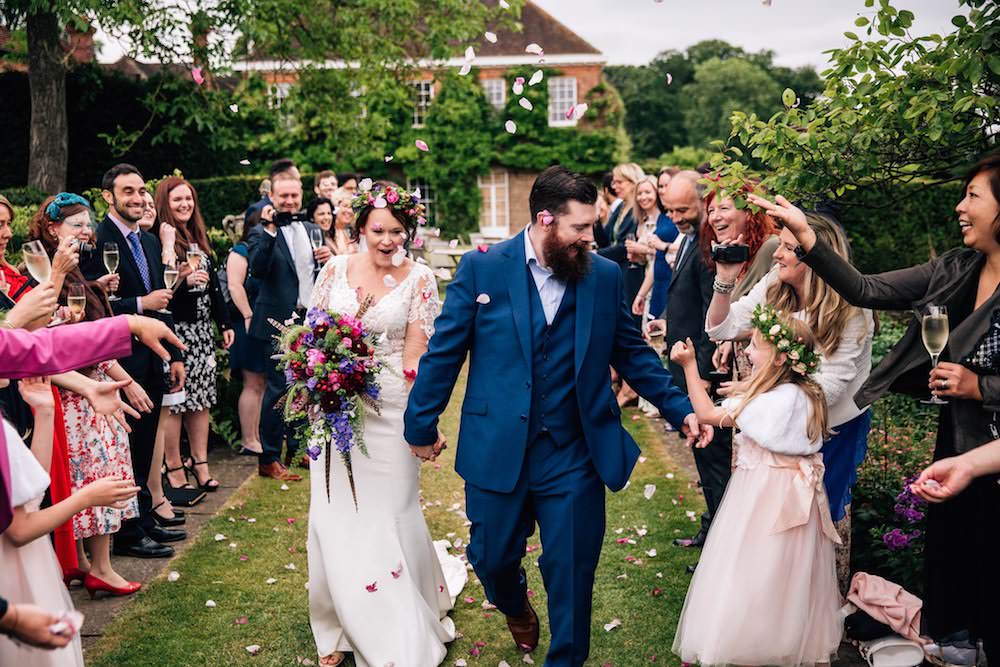 Bride Bridal Dress Gown Lace Sleeves Bodice Train Flower Crown Blue Suit Groom Bouquet Jewel Tone Pink Blue Confetti Micklefield Hall Wedding Red On Blonde Photography