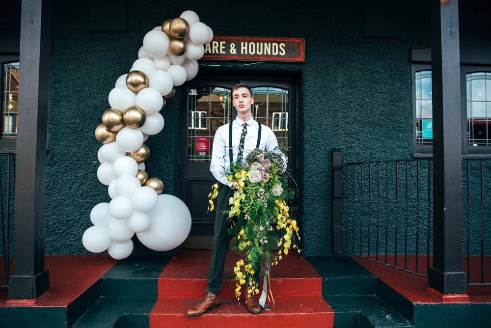 Balloon Installation Entrance Door Art White Gold Bouquet Flowers Bride Bridal Large Wild Cascading Oversized Trailing Ribbons Greenery Foliage Rose Hydrangea Modern Pub Wedding Ideas Three Flowers Photography