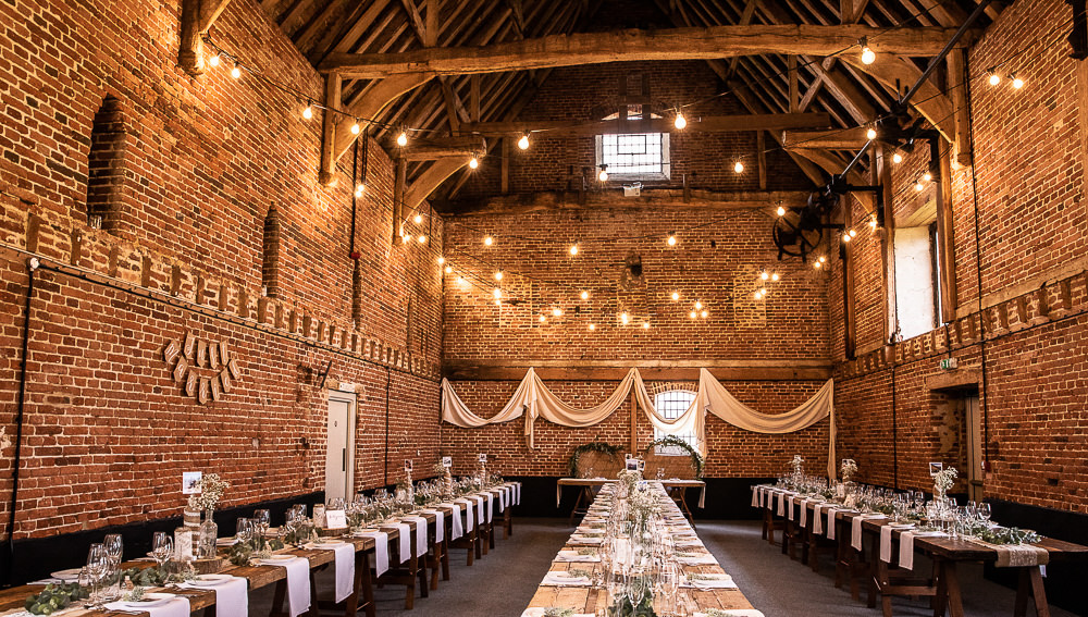 Festoon Lights Drapes Decor Long Tables Greenery Rustic Botanical Barn Wedding Lorna Newman Photography