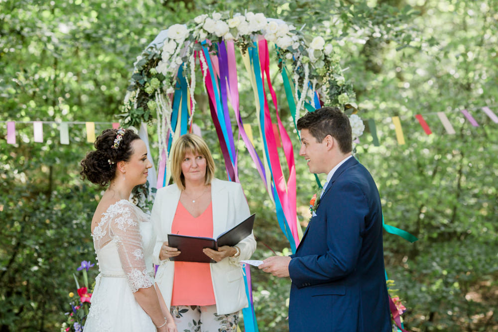 Bride Bridal Strapless Sweetheart Neckline Lace Jacket Sleeves Waistcoat Tweed Check Three Piece Suit Blue Multicoloured Ribbon Ceremony Back Drop Spring Cottage Rivington Wedding Emma B Photography