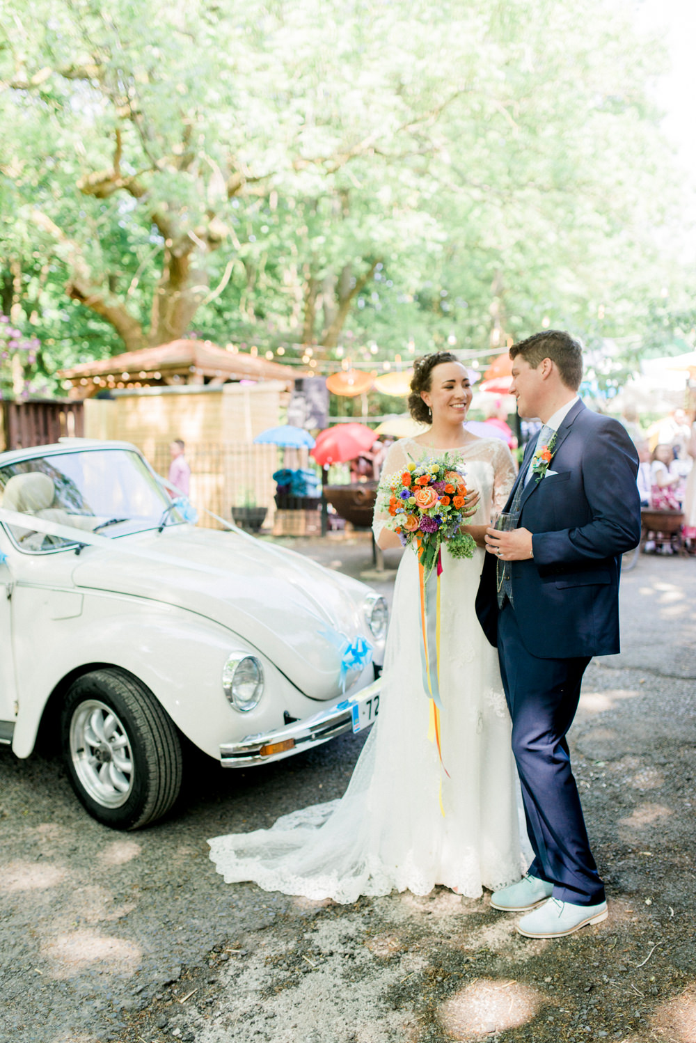 Bride Bridal Strapless Sweetheart Neckline Lace Jacket Sleeves Waistcoat Tweed Check Three Piece Suit Blue Multicoloured Bouquet Ribbon Spring Cottage Rivington Wedding Emma B Photography