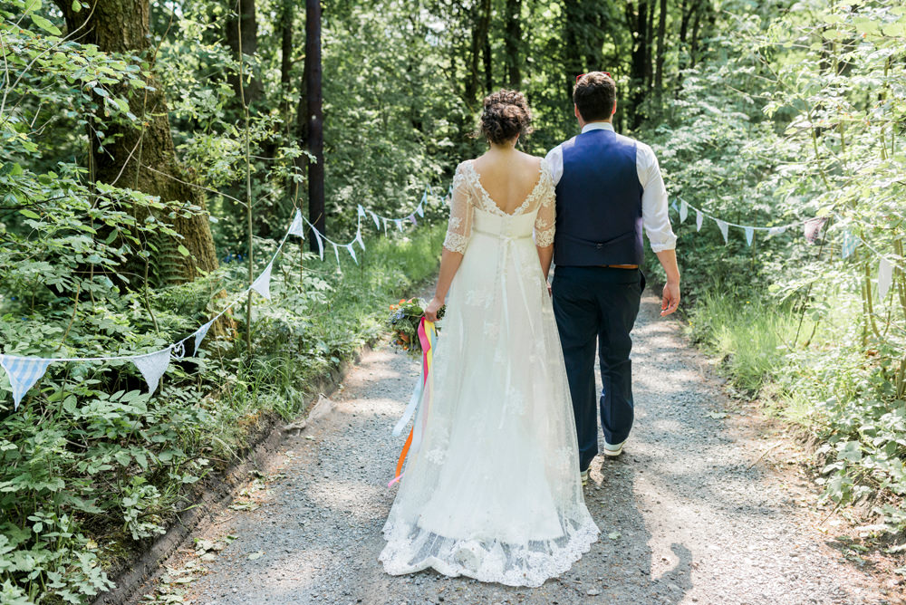 Bride Bridal Strapless Sweetheart Neckline Lace Jacket Sleeves Waistcoat Tweed Check Three Piece Suit Blue Multicoloured Bouquet Ribbon Spring Cottage Rivington Wedding Emma B Photography