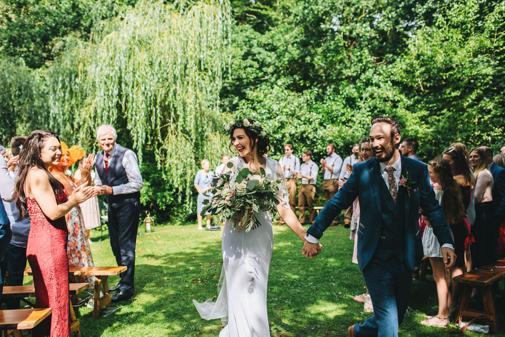 Bride Bridal Boho Wide Sleeve Dress Gown Embellished Flower Crown Blue Suit Tweed Three Piece Waistcoat Groom Foliage Bouquet Stonyford Cottage Gardens Wedding Jessica O'Shaughnessy Photography