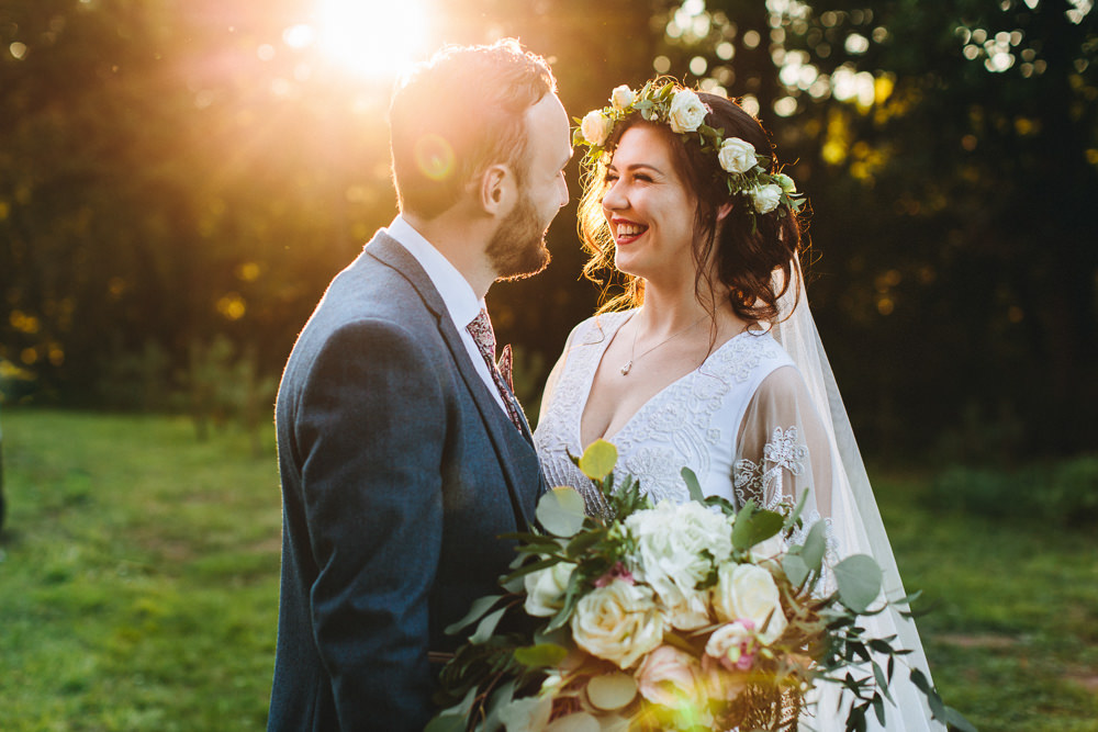 Bride Bridal Boho Wide Sleeve Dress Gown Embellished Flower Crown Blue Suit Tweed Three Piece Waistcoat Groom Foliage Bouquet Veil Stonyford Cottage Gardens Wedding Jessica O'Shaughnessy Photography
