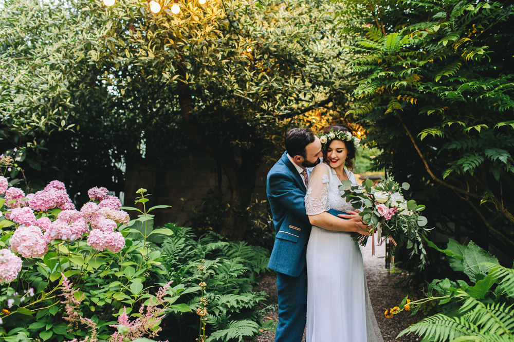 Bride Bridal Boho Wide Sleeve Dress Gown Embellished Flower Crown Blue Suit Tweed Three Piece Waistcoat Groom Foliage Bouquet Stonyford Cottage Gardens Wedding Jessica O'Shaughnessy Photography