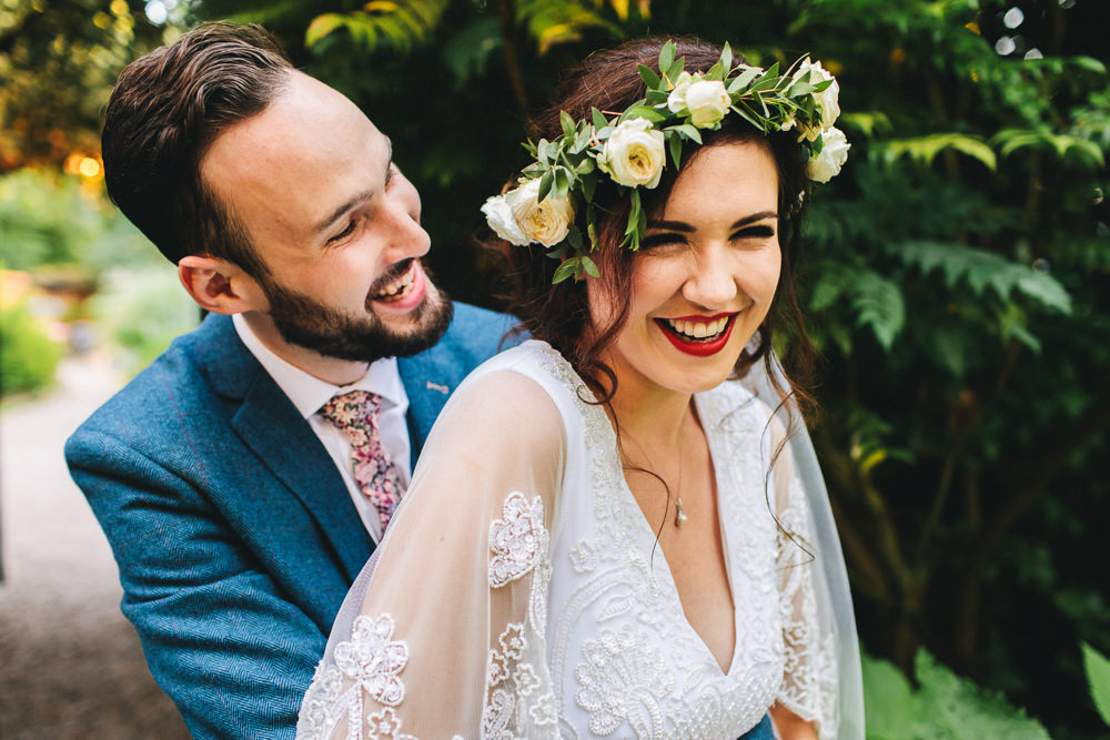 Bride Bridal Boho Wide Sleeve Dress Gown Embellished Flower Crown Blue Suit Tweed Three Piece Waistcoat Groom Foliage Bouquet Stonyford Cottage Gardens Wedding Jessica O'Shaughnessy Photography