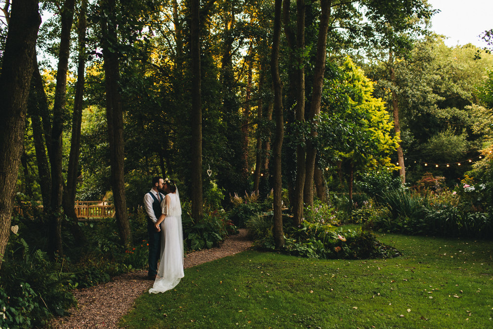 Bride Bridal Boho Wide Sleeve Dress Gown Embellished Flower Crown Blue Suit Tweed Three Piece Waistcoat Groom Stonyford Cottage Gardens Wedding Jessica O'Shaughnessy Photography