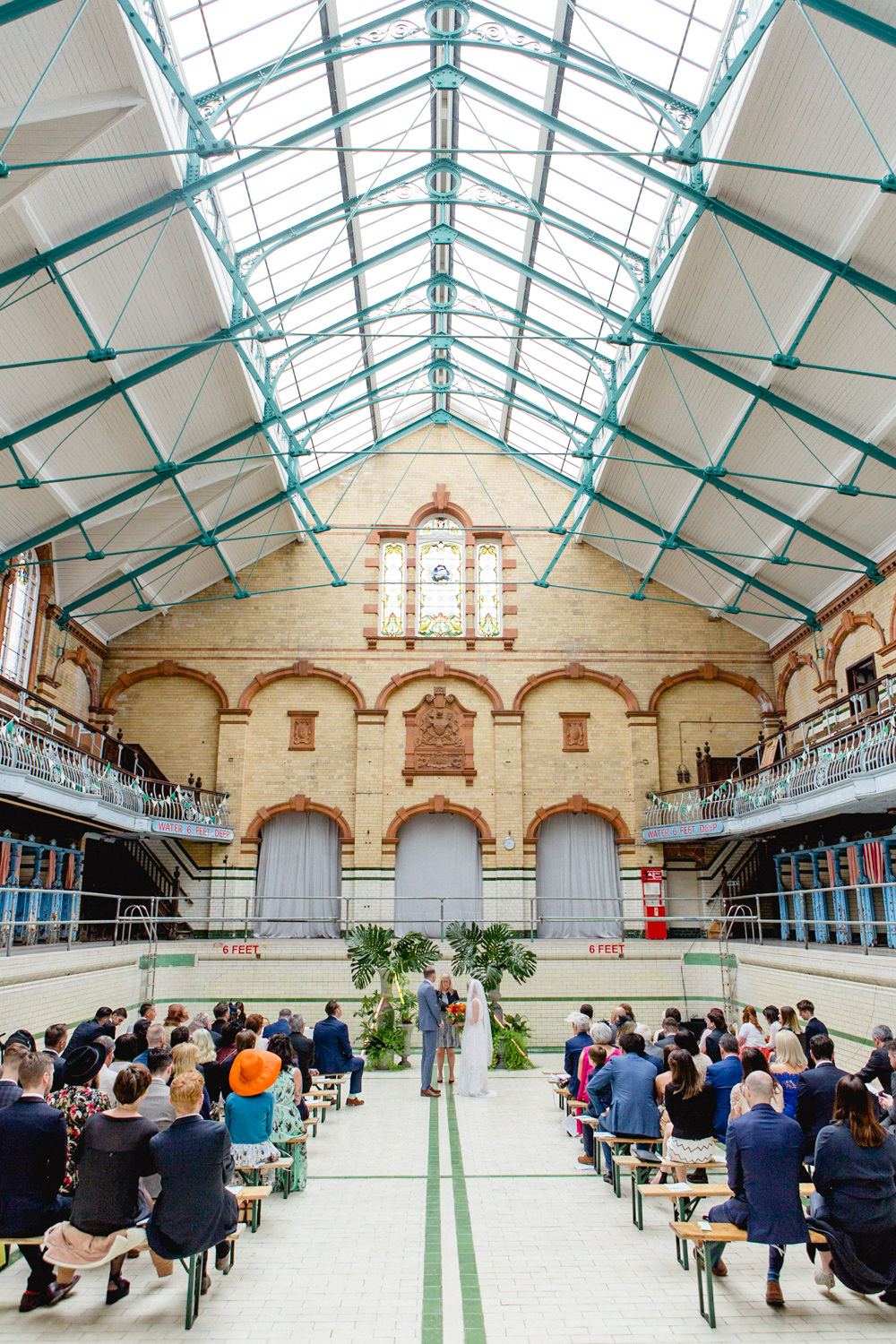 Bride Bridal V Neck Belt Veil Three Piece Suit Groom Blue Ceremony Tropical Backdrop Victoria Baths Wedding Mark Newton Weddings