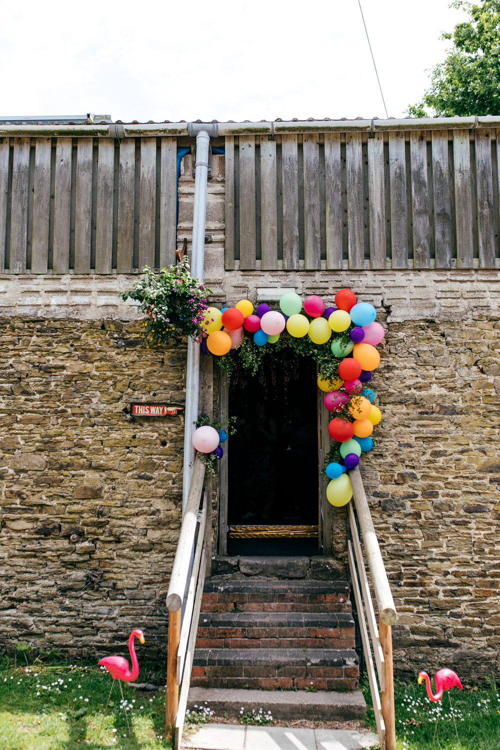 Rainbow Colourful Balloon Installation Door Ash Barton Estate Wedding Jordanna Marston Photography