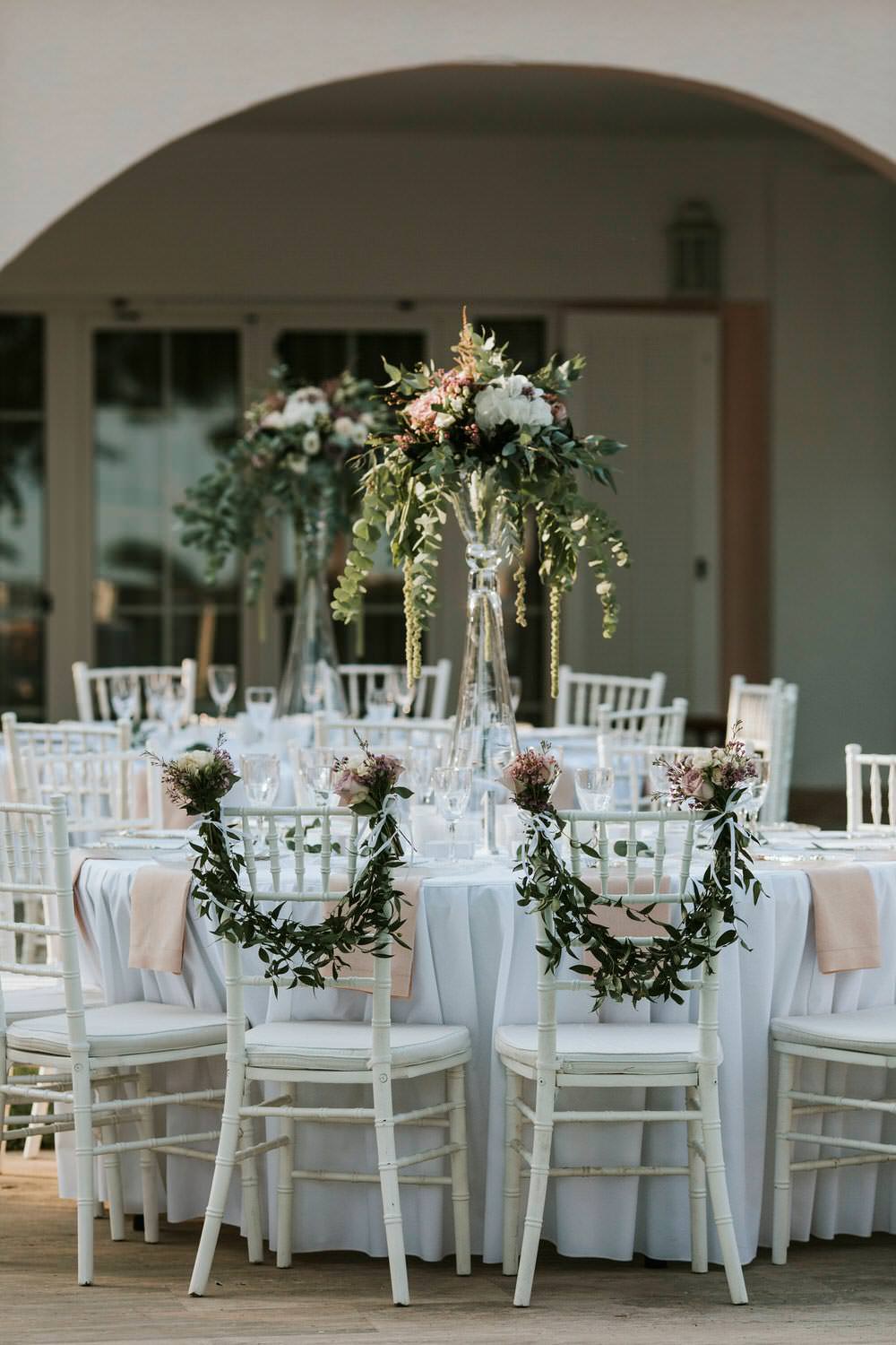 Swag Garland Greenery Foliage Chair Backs Decor Bohemian Beach Greece Destination Wedding Lighthouse Photography