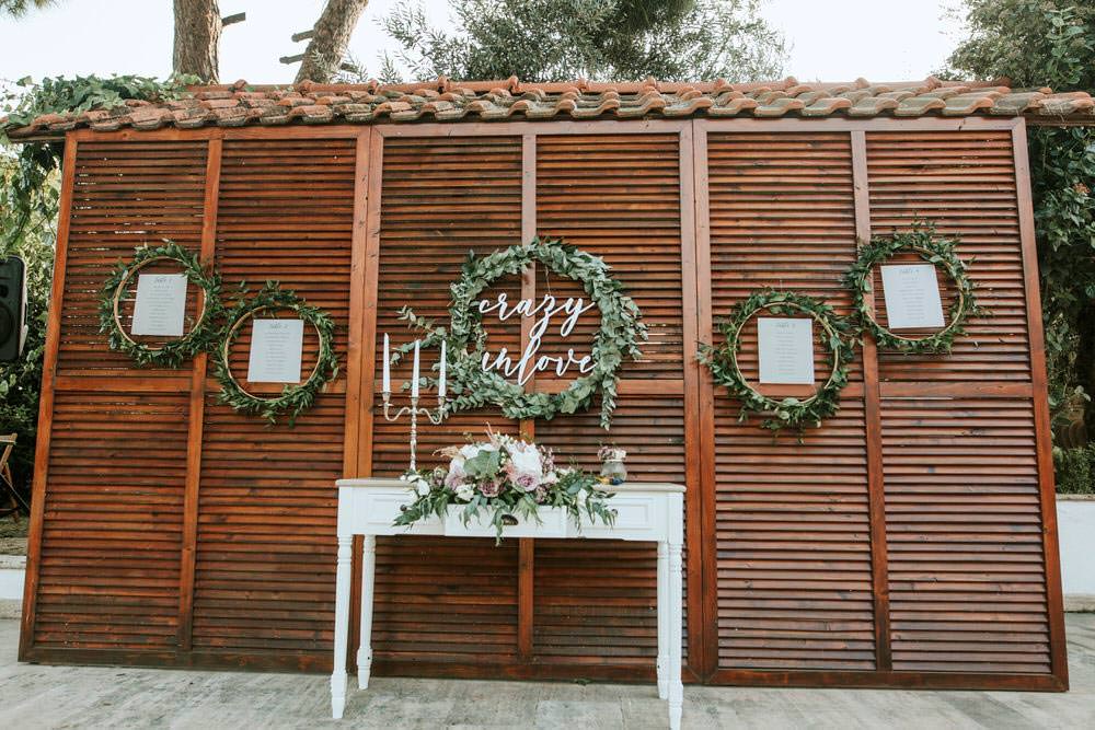 Seating Plan Table Chart Table Botanical Greenery Foliage Wreath Hoop Backdrop Flowers Bohemian Beach Greece Destination Wedding Lighthouse Photography