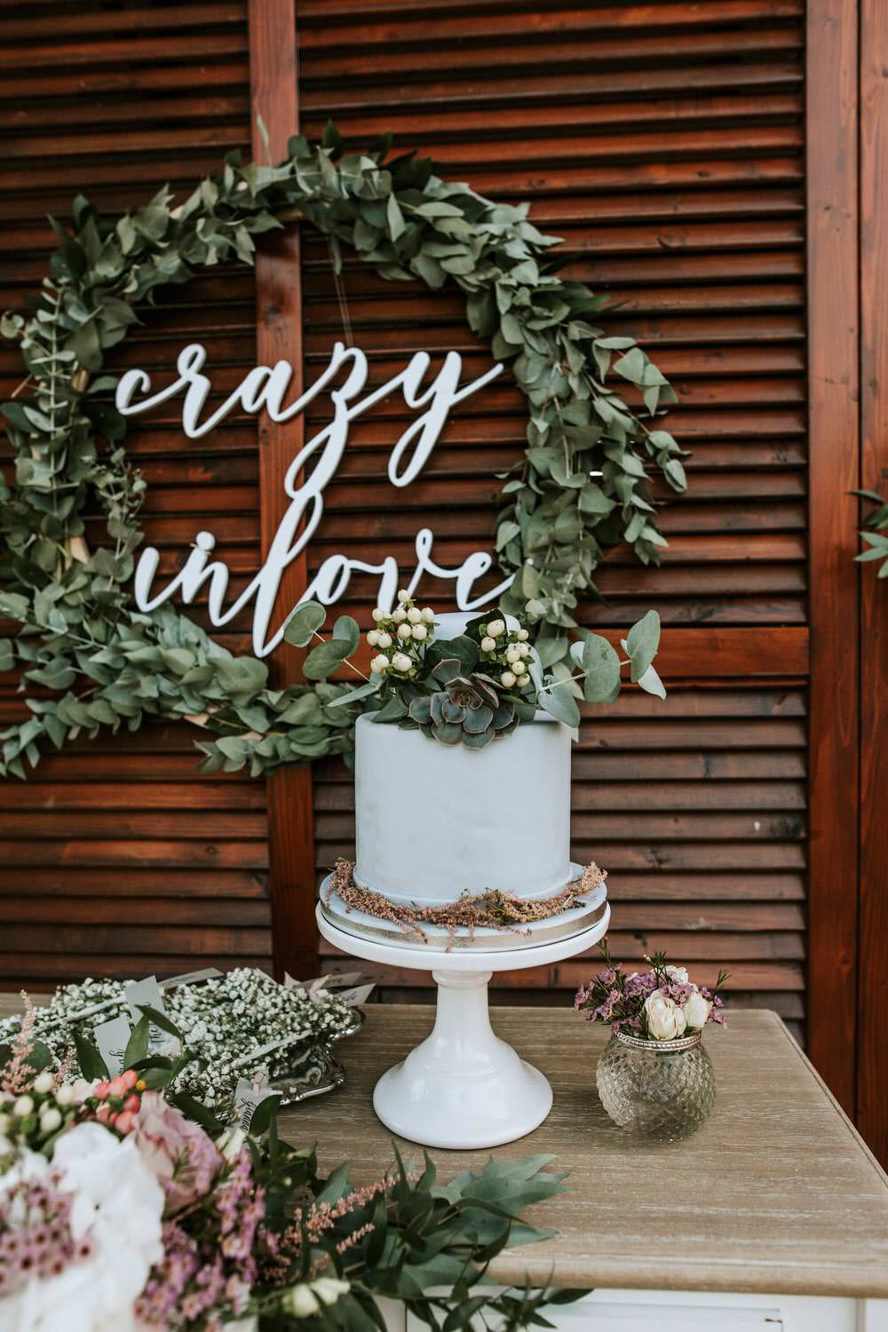 Cake Sign Laser Cut Table Botanical Greenery Foliage Wreath Hoop Backdrop Flowers Bohemian Beach Greece Destination Wedding Lighthouse Photography