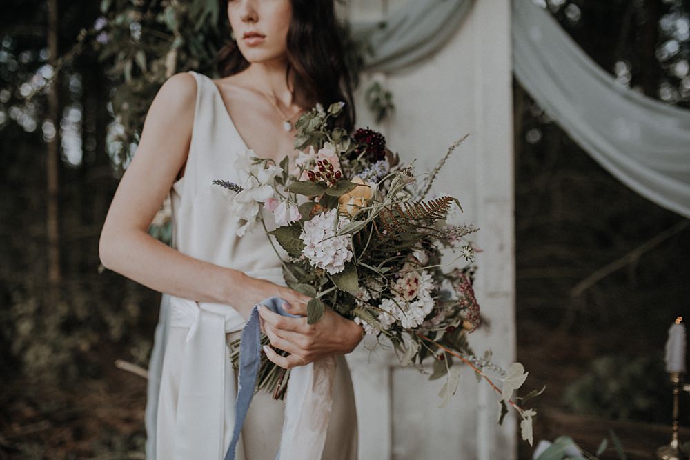 Bouquet Flowers Bride Bridal Wild Natural Whimsical Ribbons Foliage Greenery Hydrangea Berry Sweetpeas Ferns Bohemian Woodland Wedding Ideas Lola Rose Photography