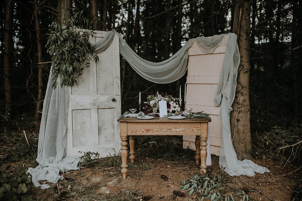 Table Tablescape Outdoors Grey Fabric Greenery Foliage Doors Antique Decor Backdrop Bohemian Woodland Wedding Ideas Lola Rose Photography