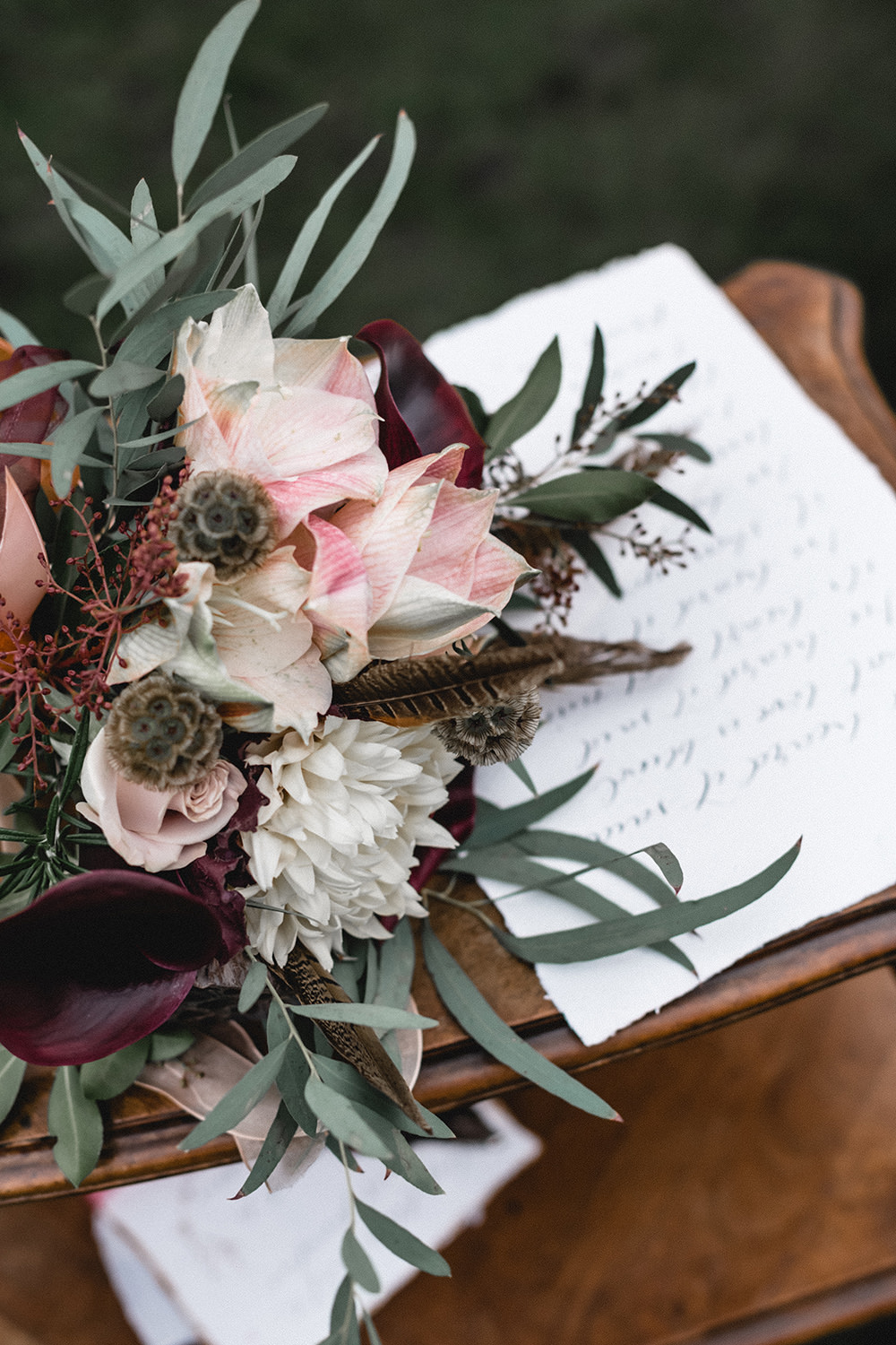 Bouquet Flowers Bride Bridal Ribbons Red Greenery Pink Foliage burgundy Calla Lily Pheasant Feathers Eucalyptus Nicoli Boho Modern Romance Wedding Ideas Masha Unwerth Photography