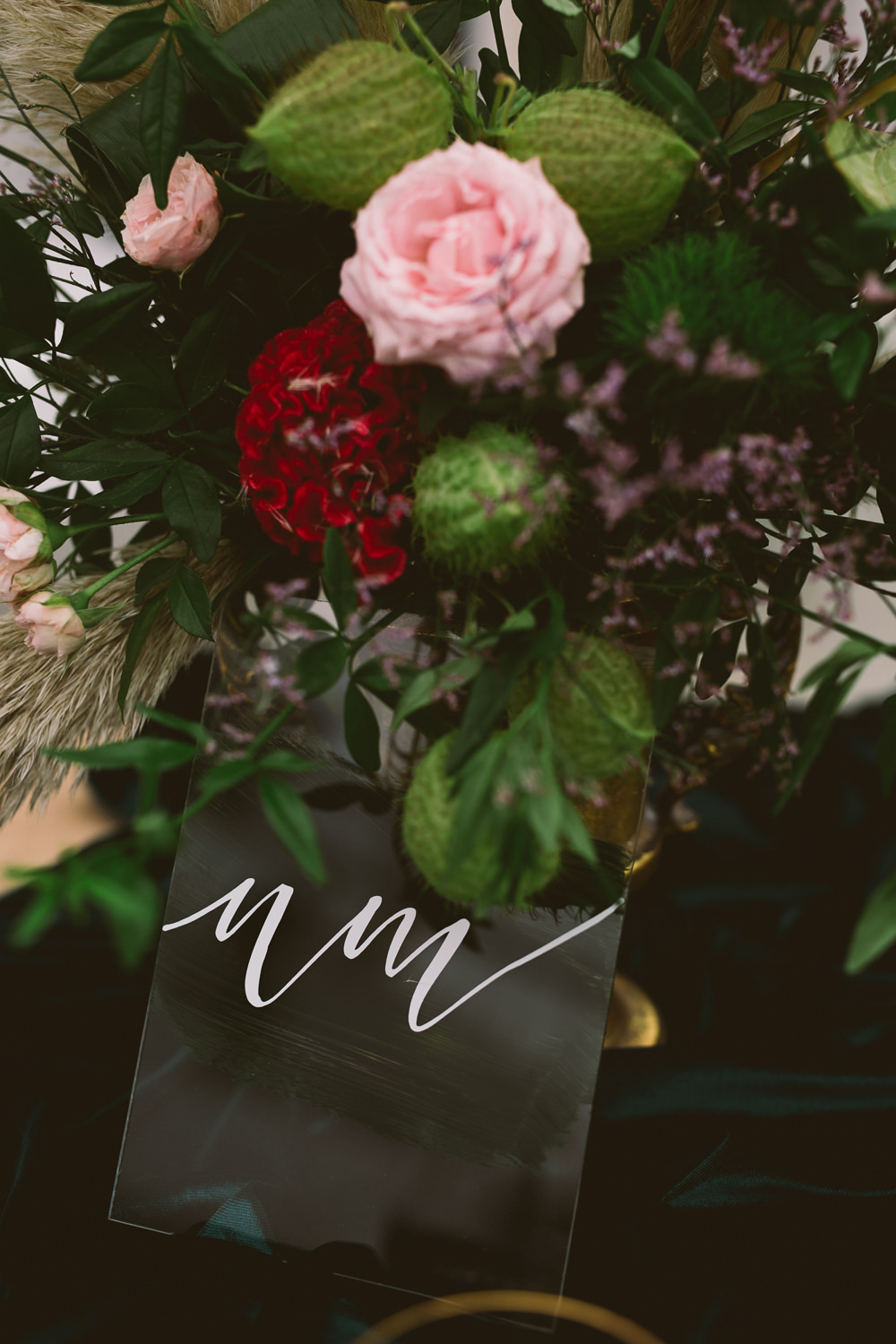 Table Flowers Centrepiece Pink Red Rose Greenery Foliage Perspex Acrylic Table Number Sign Botanical Dark Green Velvet Pampas Grass Wedding Ideas Bárbara Araújo Photography