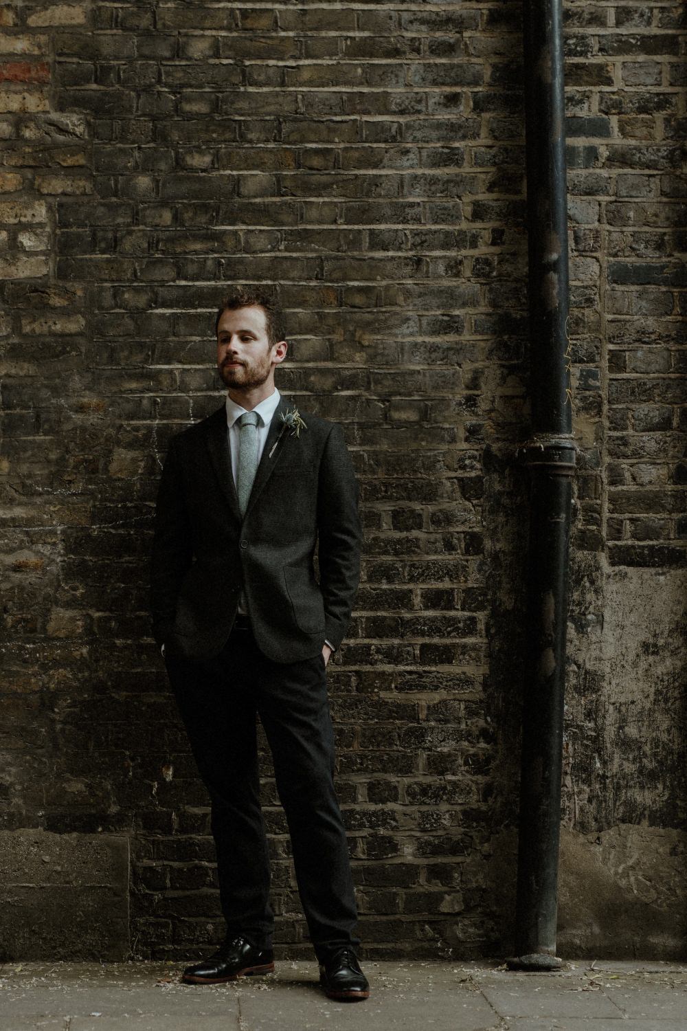 Groom Suit Charcoal Harris Tweed Suit Knitted Tie Thistle Buttonhole Brunel Museum Wedding Olivia and Dan Photography