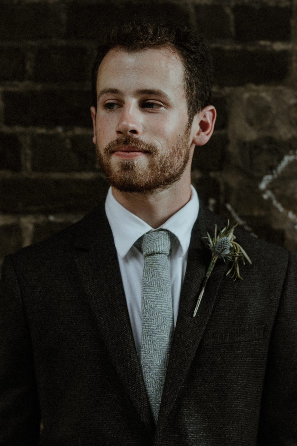 Groom Suit Charcoal Harris Tweed Suit Knitted Tie Thistle Buttonhole Brunel Museum Wedding Olivia and Dan Photography