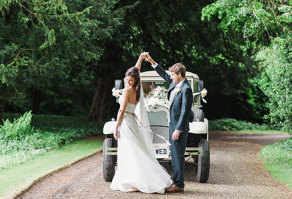 Bride Bridal Gown Dress Strapless Sweetheart Neckline Ribbon Belt Pink Blue Suit Groom Vintage Car Transport Edmondsham House Wedding Darima Frampton Photography