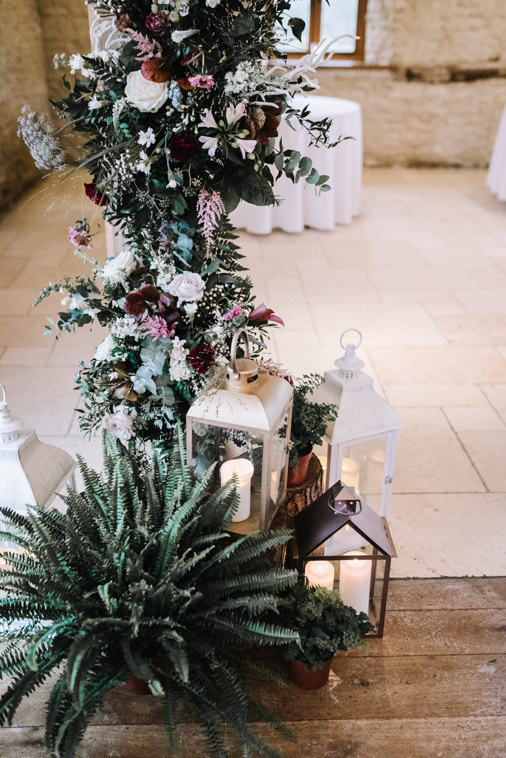 Flower Floral Arch Backdrop Ceremony Aisle Lanterns Greenery Foliage Candles Fern Pink Red Kingscote Barn Wedding Oobaloos Photography