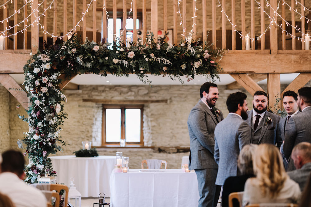 Flower Floral Arch Backdrop Ceremony Aisle Lanterns Greenery Foliage Candles Fern Pink Red Kingscote Barn Wedding Oobaloos Photography