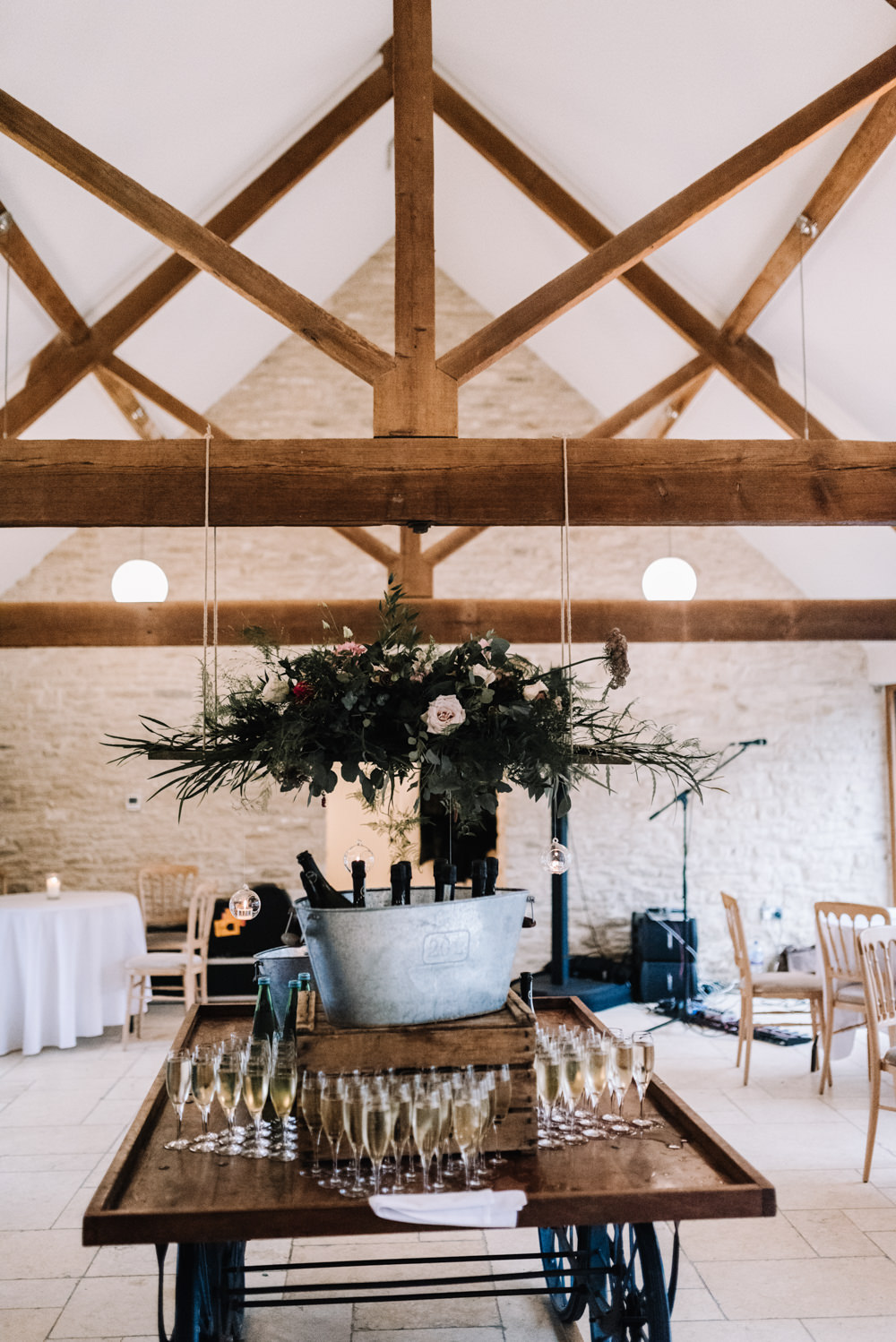 Suspended Hanging Chandelier Flower Floral Decor Greenery Foliage Pink Red Kingscote Barn Wedding Oobaloos Photography
