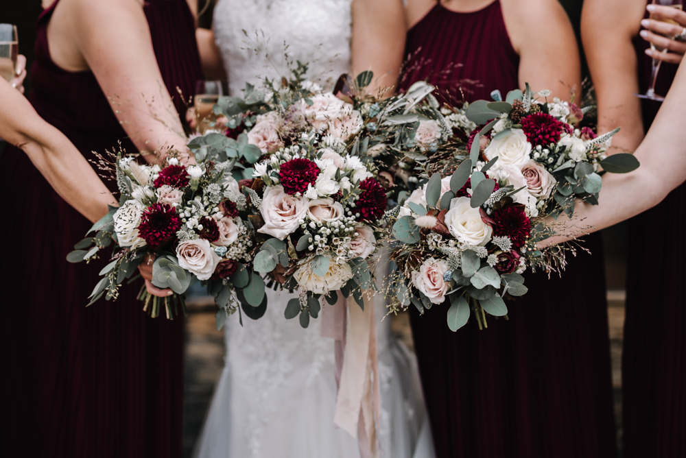 Bouquet Flowers Red Pink Burgundy Bride Bridal Rose Greenery Foliage Ribbons Dahlia Eucalyptus Bridesmaids Kingscote Barn Wedding Oobaloos Photography