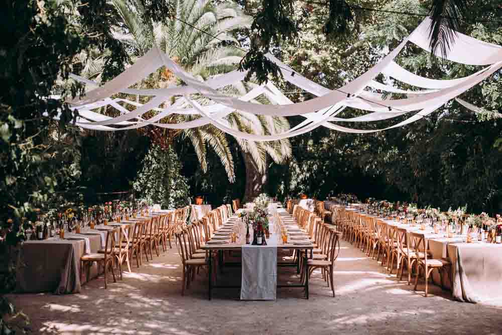 Reception Decor Long Wooden Tables Fabric Drapes Ceiling Botanical Gardens Outdoor Mountain Wedding Spain Lorena Erre