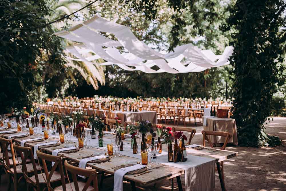 Reception Decor Long Wooden Tables Fabric Drapes Ceiling Botanical Gardens Outdoor Mountain Wedding Spain Lorena Erre