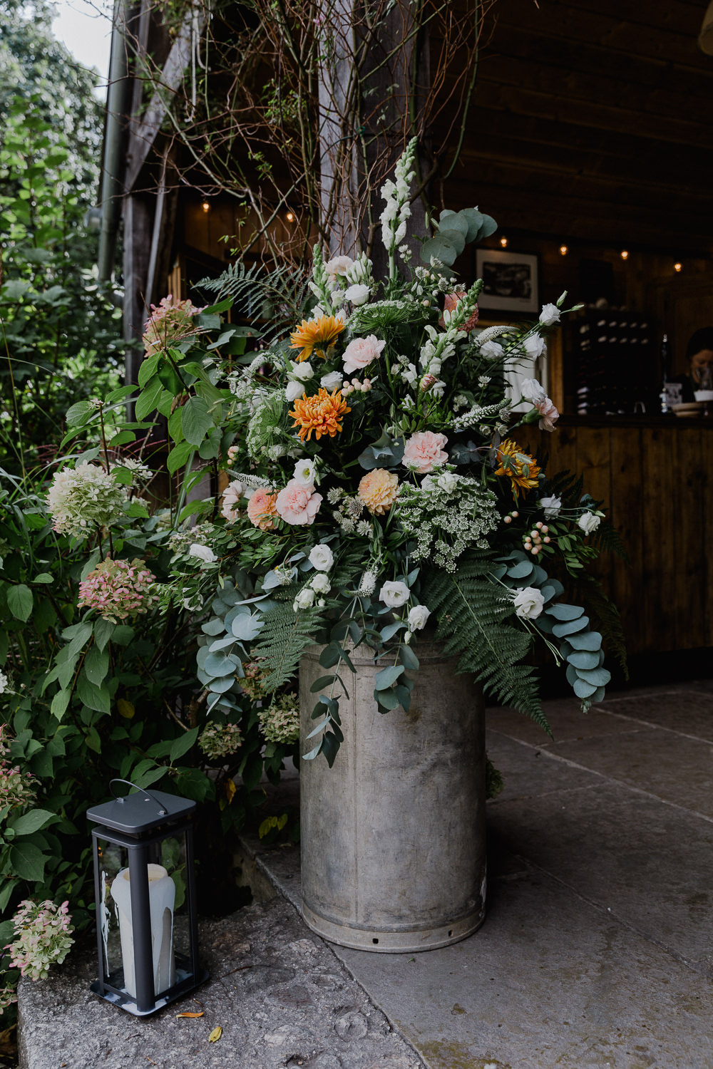Milk Churn Floral Arrangement Flowers Greenery Ferns Eucalyptus Nancarrow Farm Wedding Alexa Poppe Wedding Photography