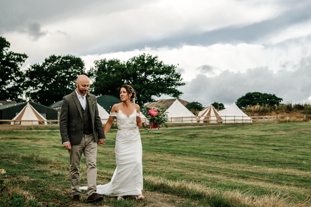 Bride Bridal Dress Gown Lace Detail Drop Cold Shoulder Ribbon Bow Sleeveless Tweed Suit Waistcoat Groom Floral Veil Bouquet Stanford Farm Wedding Andy Griffiths Photography