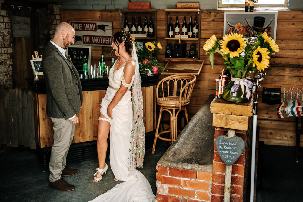 Bride Bridal Dress Gown Lace Detail Drop Cold Shoulder Ribbon Bow Sleeveless Tweed Suit Waistcoat Groom Floral Veil Garter Stanford Farm Wedding Andy Griffiths Photography