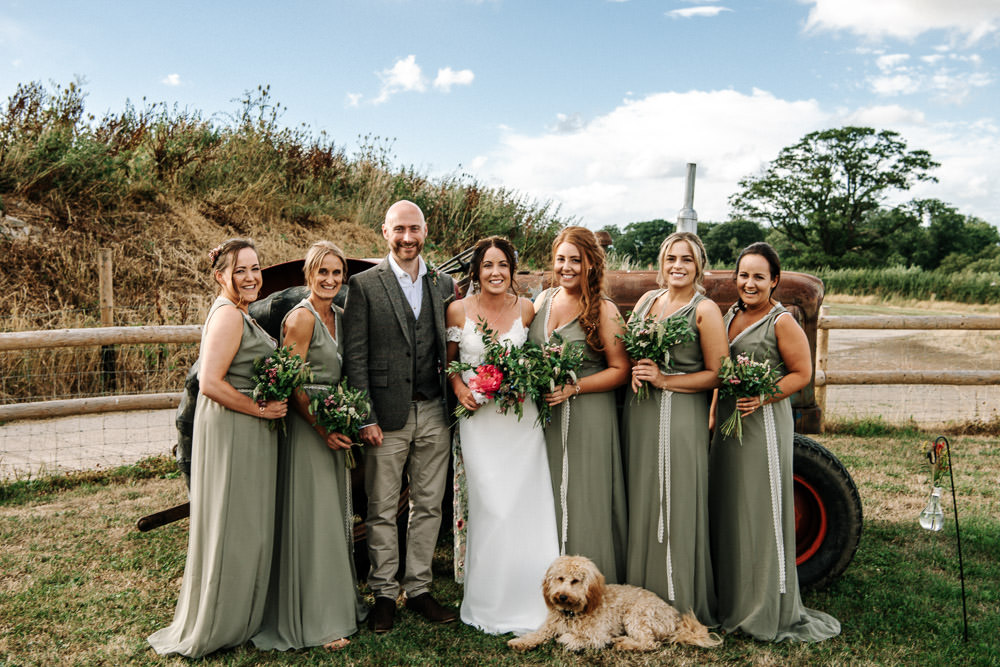 Bride Bridal Dress Gown Lace Detail Drop Cold Shoulder Ribbon Bow Sleeveless Tweed Suit Waistcoat Groom Floral Veil Sage Bridesmaids Stanford Farm Wedding Andy Griffiths Photography