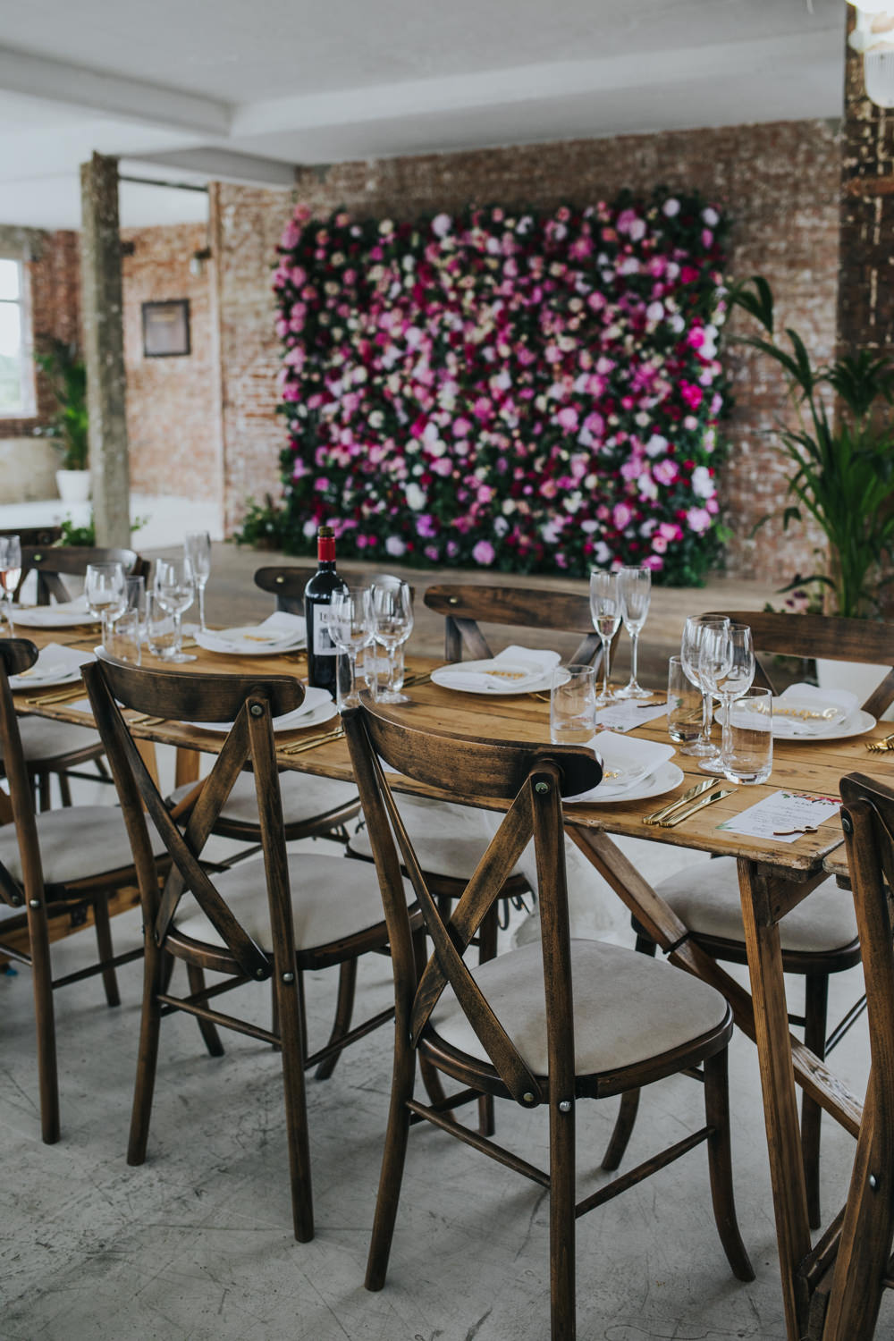 Long Wooden Rustic Table Chairs Pink Flower Wall Backdrop Wimborne House Wedding Eva Photography