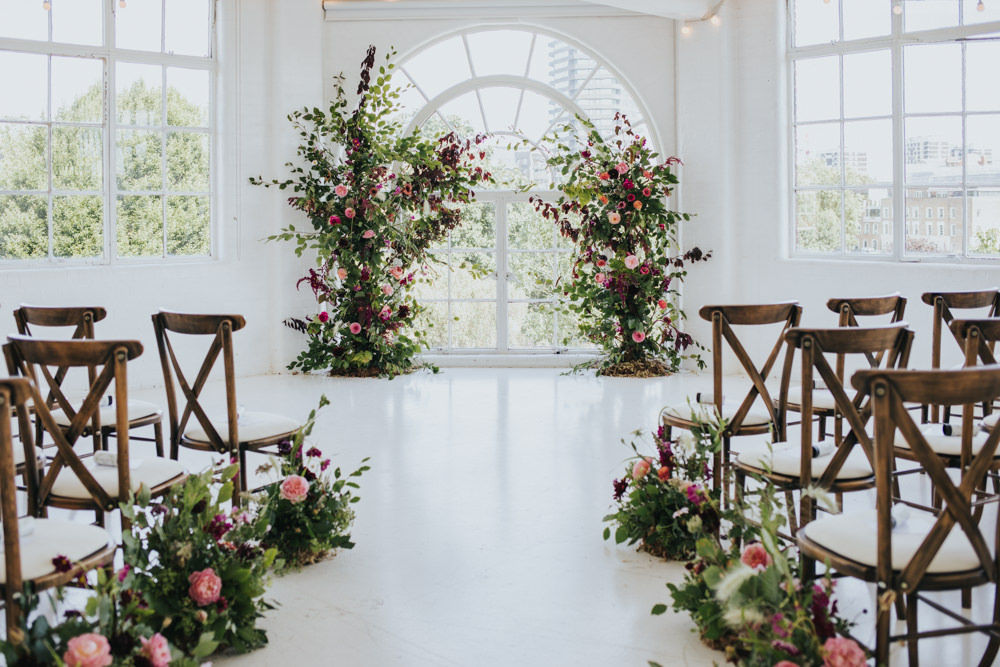 Ceremony Aisle Backdrop Arch Flower Floral Installation Wild Natural Pretty Greenery Foliage Pink Wimborne House Wedding Eva Photography