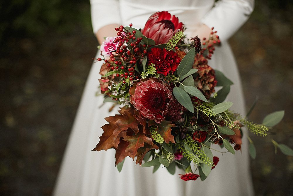 Bouquet Flowers Bride Bridal Red Burgundy Protea Greenery Foliage Abbeydale Picture House Wedding We Are Da Silva