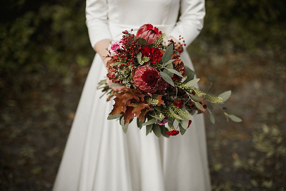 Bouquet Flowers Bride Bridal Red Burgundy Protea Greenery Foliage Abbeydale Picture House Wedding We Are Da Silva