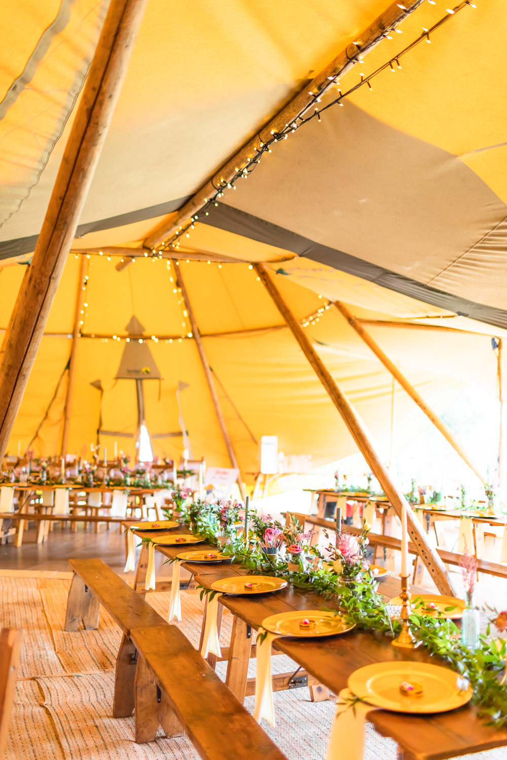 Rustic Table bench Fairy Lights Greenery Garland Bedfordshire Tipi Wedding Natalie Stevenson Photography