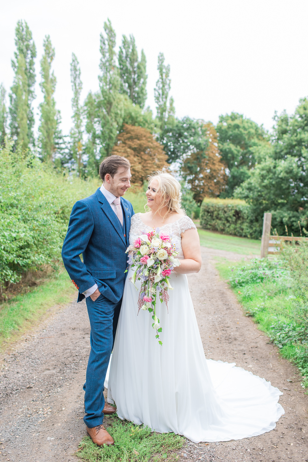Bride Bridal Short Sleeve Lace V Neck Dress Gown Navy Wool Tweed Suit Groom Waterfall Bouquet Bedfordshire Tipi Wedding Natalie Stevenson Photography