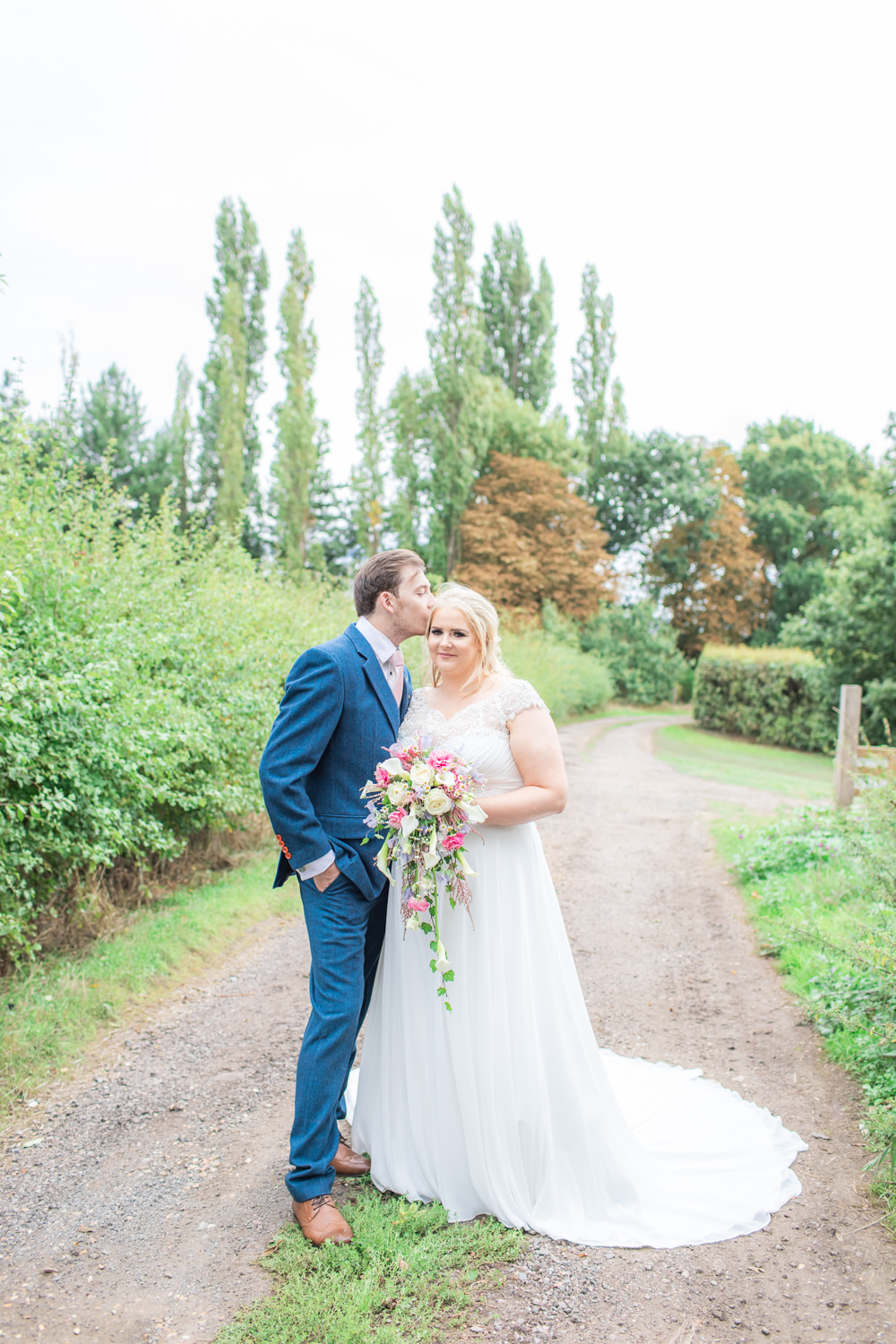 Bride Bridal Short Sleeve Lace V Neck Dress Gown Navy Wool Tweed Suit Groom Waterfall Bouquet Bedfordshire Tipi Wedding Natalie Stevenson Photography