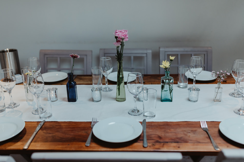 Simple Wooden Table Decor Flowers Bottles Chilli Barn Wedding Stevie Jay Photography