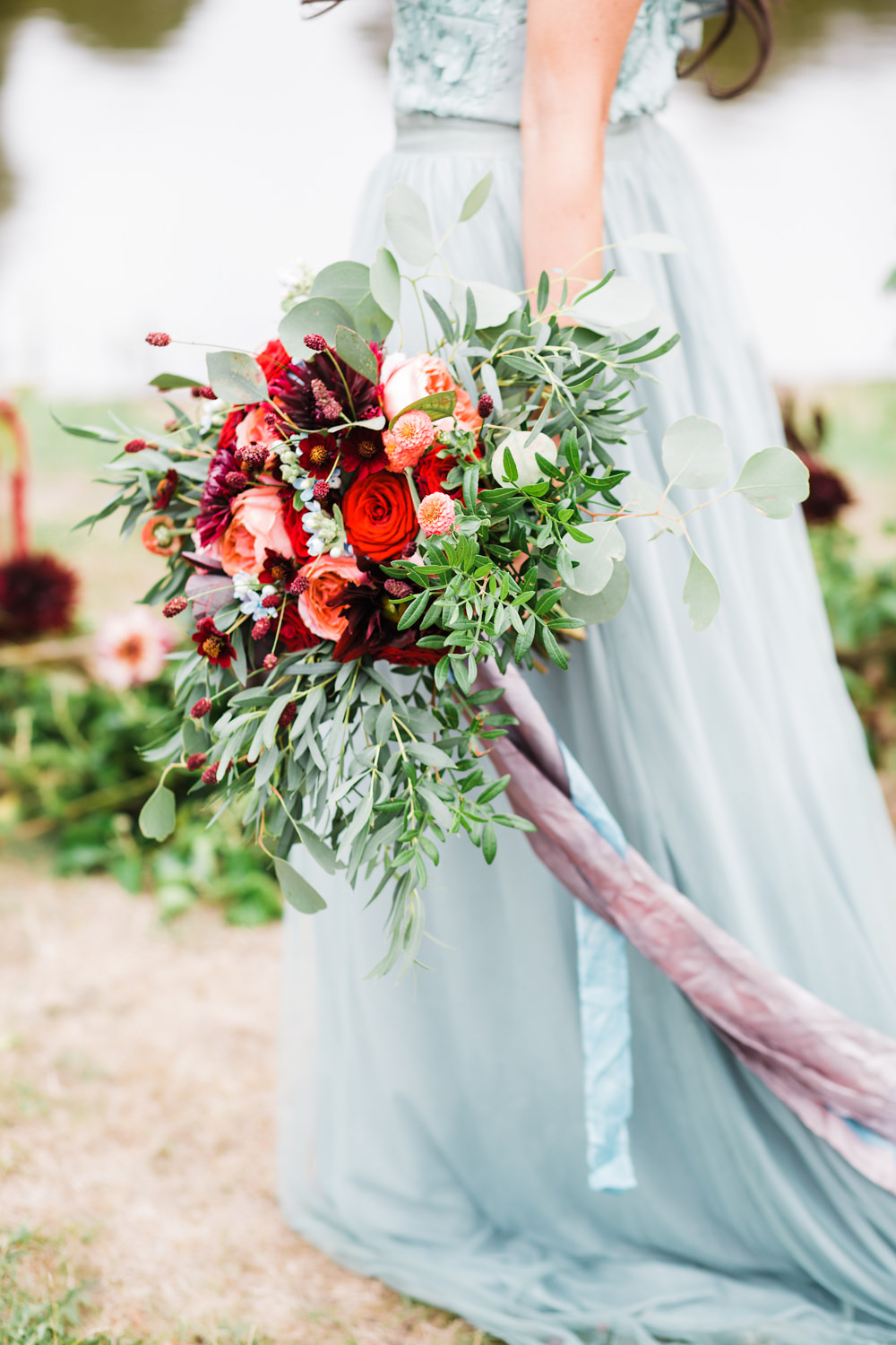 Bouquet Flowers Bride Bridal Greenery Foliage Rose Red Orange Cosmos Dahlias Oxypetalum Ribbons Ethereal Romantic Wedding Ideas Katherine Newman Photography