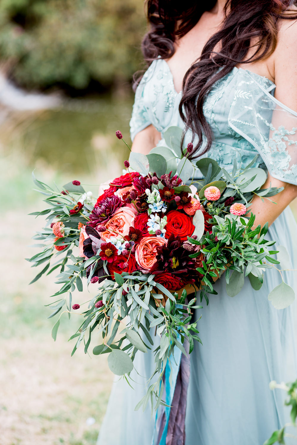 Bouquet Flowers Bride Bridal Greenery Foliage Rose Red Orange Cosmos Dahlias Oxypetalum Ribbons Ethereal Romantic Wedding Ideas Katherine Newman Photography