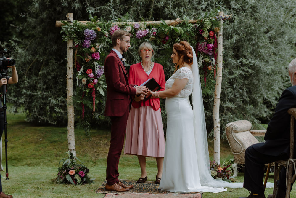 Bride Bridal Short Cap Sleeve Slip Dress Laure de Sagazan Dress Gown V Back Veil Red Wine Burgundy Suit Foliage Flowers Ceremony Arch Felin Newydd House Wedding Christopherian.co.uk