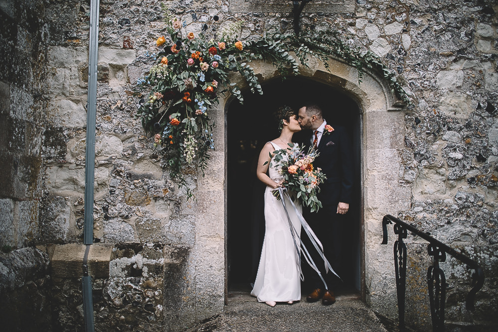 Arch Flowers Door Way Coral Peach Rose Dahlia Thistle Greenery Gilbert Whites House Barn Wedding Carrie Lavers Photography