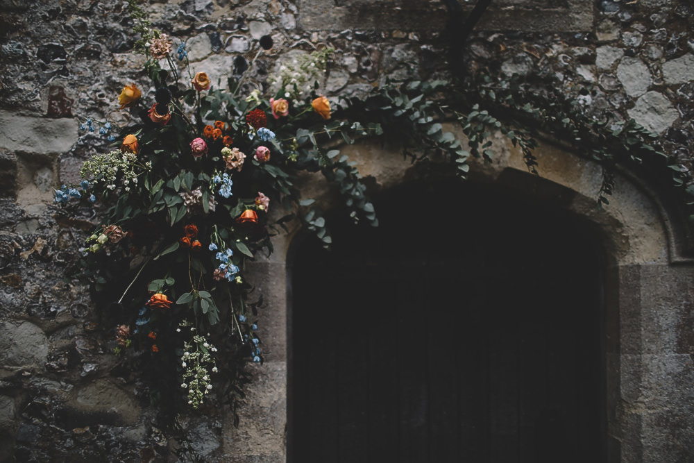 Arch Flowers Door Way Coral Peach Rose Dahlia Thistle Greenery Gilbert Whites House Barn Wedding Carrie Lavers Photography