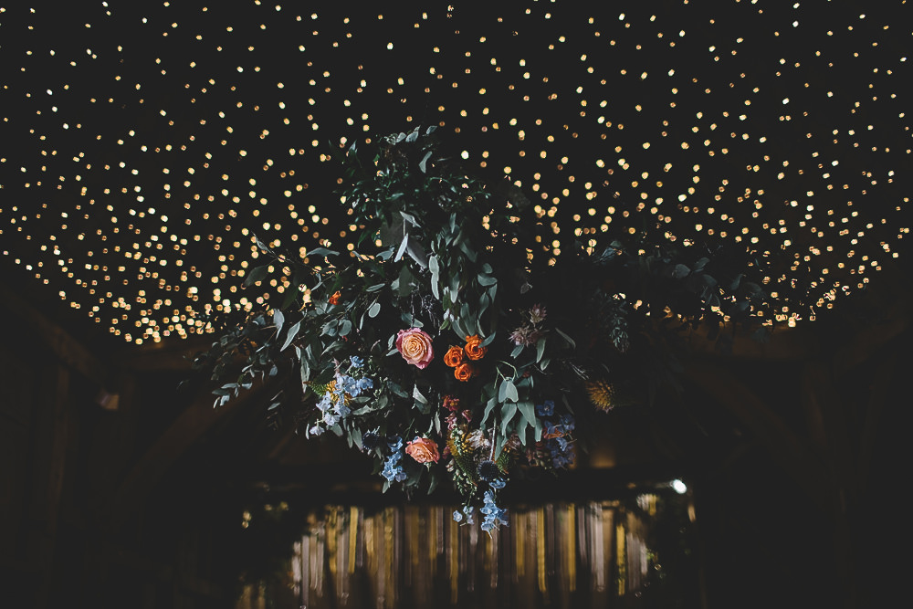 Hanging Suspended Flowers Greenery Rose Orange Coral Decor Gilbert Whites House Barn Wedding Carrie Lavers Photography