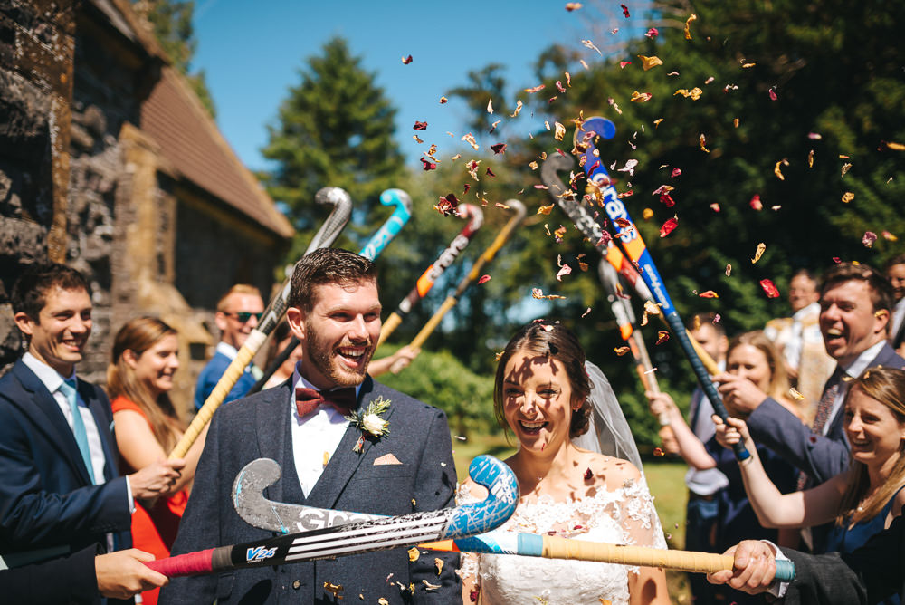 Bride Bridal Dress Gown Sweetheart Bolero Off Shoulder Lace Navy Suit Groom Burgundy Oxblood Bow Tie Veil Confetti Hockey Stick Guard of Honour Kittisford Barton Wedding Joab Smith Photography